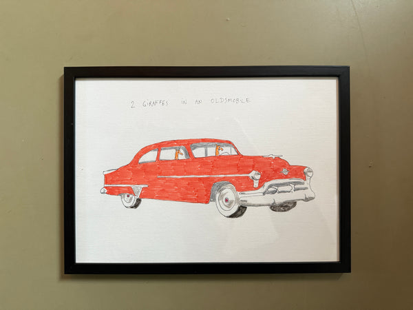 2 giraffes in an oldsmobile