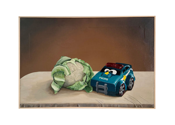 Still life with cauliflower and toy