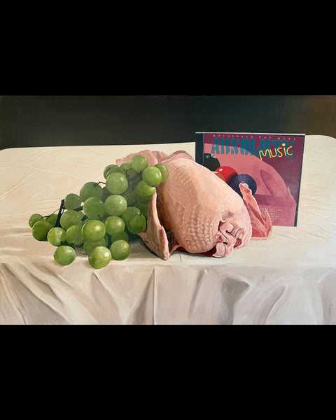 Still life with grapes, chicken and bangers